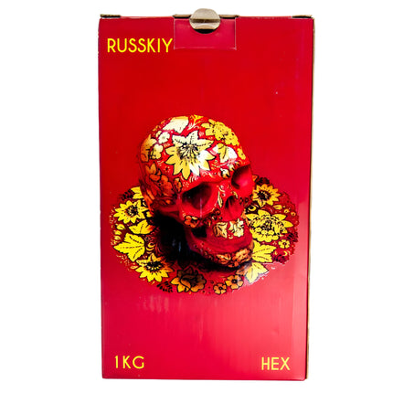 Front view of Russkiy Hexagon Shisha Charcoal 1kg box, red with a decorated skull design
